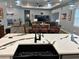 Open concept kitchen with a large island, modern fixtures, and views into the adjacent living and dining areas at 837 Oaks Shores Rd, Leesburg, FL 34748