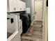 Laundry room with washer, dryer, and built-in cabinetry at 837 Oaks Shores Rd, Leesburg, FL 34748