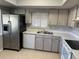 Modern kitchen with stainless steel appliances and light wood cabinets at 940 Fenton Ln # 16, Lakeland, FL 33809