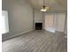 Spacious living room featuring a fireplace and vinyl plank flooring at 940 Fenton Ln # 16, Lakeland, FL 33809