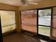 Bright screened porch with a view and ceiling fan at 940 Fenton Ln # 16, Lakeland, FL 33809