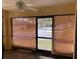 Bright screened porch with view, ceiling fan, and ample natural light at 940 Fenton Ln # 16, Lakeland, FL 33809