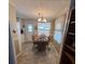 Dining area with built-in shelving and wood table at 110 Dogwood Trl, Leesburg, FL 34748