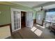 Home office with French doors leading to outside at 110 Dogwood Trl, Leesburg, FL 34748