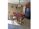 Cozy dining area with a wooden table set and natural light at 1273 Tyler Lake Cir, Orlando, FL 32839