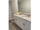 Bathroom with double sinks, granite counters, and a shower/tub combination at 144 Links Terrace, Daytona Beach, FL 32124