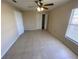 Bright bedroom with tile flooring, double closet, and ceiling fan at 1608 Long Ridge Ct # 274, Orlando, FL 32807