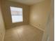 Simple bedroom with tile floors and neutral walls at 1608 Long Ridge Ct # 274, Orlando, FL 32807