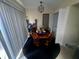 Cozy dining area with a wooden table and four chairs at 1608 Long Ridge Ct # 274, Orlando, FL 32807