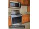 Updated kitchen with stainless steel appliances and granite countertops at 1608 Long Ridge Ct # 274, Orlando, FL 32807