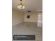 Bright and airy living room with tile flooring and modern lighting fixtures at 1608 Long Ridge Ct # 274, Orlando, FL 32807
