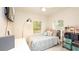 Bright bedroom with a comfortable bed and plenty of natural light at 16546 7Th St, Montverde, FL 34756