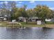 Lakefront home with dock and jet skis at 1860 Lake Markham Rd, Sanford, FL 32771