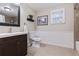 Updated bathroom with dark vanity, subway tile, and a bathtub at 1860 Lake Markham Rd, Sanford, FL 32771