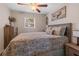 Bedroom with patterned bedding and a dresser at 1860 Lake Markham Rd, Sanford, FL 32771