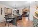 Dining area with farmhouse table and view into living room and kitchen at 1860 Lake Markham Rd, Sanford, FL 32771