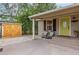 Inviting front porch with rocking chairs and shed at 1860 Lake Markham Rd, Sanford, FL 32771