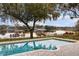 Inviting pool with stunning lake views and lush landscaping at 1860 Lake Markham Rd, Sanford, FL 32771