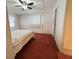 Bedroom with double bed and ceiling fan at 188 Azalea Trl, Leesburg, FL 34748