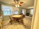 Dining area with round table and four chairs at 188 Azalea Trl, Leesburg, FL 34748