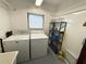 Laundry room with washer, dryer and storage at 188 Azalea Trl, Leesburg, FL 34748