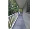 Private balcony overlooking a tree-filled yard at 253 N Blue Lake Ave, Deland, FL 32724