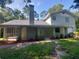 Two-story house with green exterior, landscaped yard, and attached garage at 253 N Blue Lake Ave, Deland, FL 32724