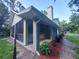 Spacious screened porch with red mulch landscaping at 253 N Blue Lake Ave, Deland, FL 32724