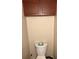 Simple bathroom with toilet and overhead cabinet at 255 Sandlewood Trl # 4, Winter Park, FL 32789