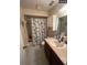 Bathroom with shower, single vanity, and cabinet at 255 Sandlewood Trl # 4, Winter Park, FL 32789