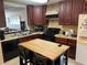 Well-equipped kitchen boasting dark wood cabinets at 255 Sandlewood Trl # 4, Winter Park, FL 32789