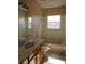 Clean bathroom with tub, shower, and vanity at 2802 Quiet Water Trl, Kissimmee, FL 34744