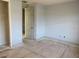 Empty bedroom with gray walls and wood flooring at 2802 Quiet Water Trl, Kissimmee, FL 34744