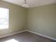 Spacious bedroom with light walls and carpeted floor at 2802 Quiet Water Trl, Kissimmee, FL 34744