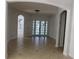 Spacious entryway with tile floors and double French doors at 2802 Quiet Water Trl, Kissimmee, FL 34744