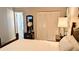 Main bedroom with a wooden bed frame, nightstands, and built-in closet at 2809 Bower Rd, Winter Park, FL 32792