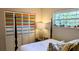 Bedroom with a colorful closet and a wooden bed frame at 2809 Bower Rd, Winter Park, FL 32792