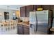 Modern kitchen with dark wood cabinets and granite countertops at 2809 Bower Rd, Winter Park, FL 32792