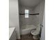 Updated bathroom with marble tile and bathtub at 325 Garden St, Daytona Beach, FL 32114