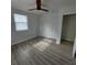 Well-lit bedroom featuring wood-look floors and ample closet space at 325 Garden St, Daytona Beach, FL 32114