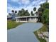 Charming house with a long driveway and tropical landscaping at 325 Garden St, Daytona Beach, FL 32114