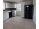 Modern kitchen featuring white cabinets and black appliances at 325 Garden St, Daytona Beach, FL 32114