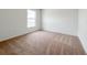 Bright bedroom with plush carpeting and a large window providing natural light at 3556 Elliot Pl, Bartow, FL 33830
