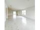 Bright living room features marble floors, natural light, and neutral paint palette at 3556 Elliot Pl, Bartow, FL 33830