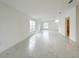 Bright living room features marble floors, natural light, and neutral paint palette at 3556 Elliot Pl, Bartow, FL 33830