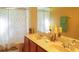 Bathroom with double vanity and shower/tub at 4055 Beacon Ridge Way, Clermont, FL 34711