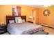 Bright bedroom with king-size bed and en-suite bathroom at 4055 Beacon Ridge Way, Clermont, FL 34711