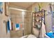 Clean bathroom with shower/tub combo and shelving at 4481 Reding Way, Lakeland, FL 33813