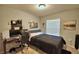 Bedroom with a double bed, desk, and window at 4481 Reding Way, Lakeland, FL 33813