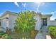 Front entrance with dark door and landscaping at 4481 Reding Way, Lakeland, FL 33813